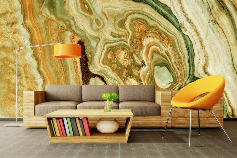 The striking green and brown marble-patterned wall feature in this modern living room evokes the essence of "Beneath The Earth." The wallpaper's elements include deep green tones resembling lush forest floors, intertwined with rich, earthy brown veins that mimic underground geological layers. The dynamic patterns create a sense of natural movement and depth. Shades of moss green and chocolate brown dominate, with occasional hints of darker emerald and lighter tan streaks providing contrast. This intricate design transforms the space into a contemporary yet grounded environment.
