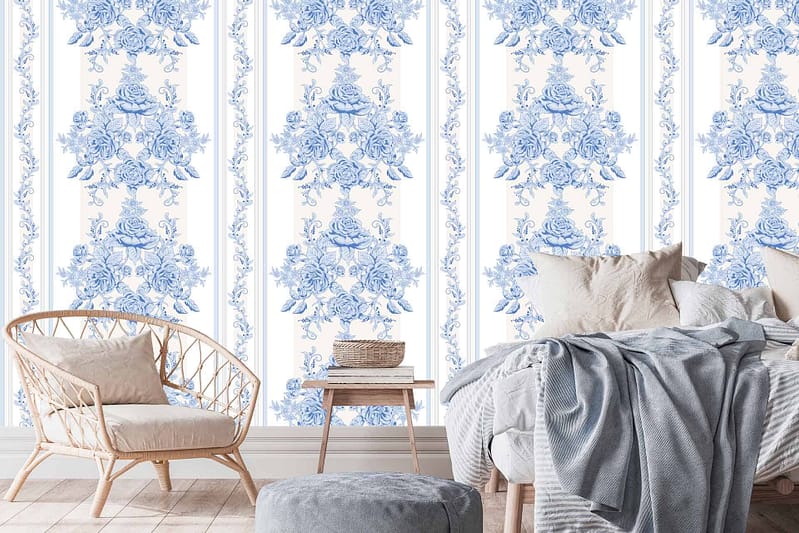 The blue floral wallpaper features a serene blue backdrop adorned with delicate white and pastel flowers, intricate vines, and subtle green leaves, evoking charm and sophistication.