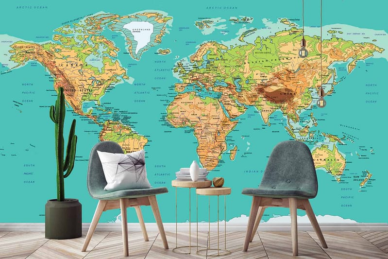 The wallpaper showcases a large, detailed world map mural. Elements include intricate coastlines, mountain ranges, and ocean currents. The colors range from muted earth tones to vibrant blues and greens, bringing a sense of adventure and exploration to the room.