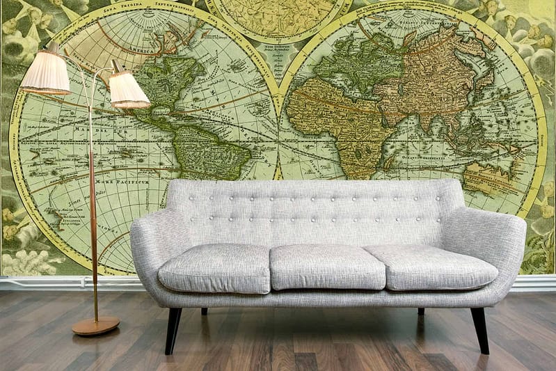 The wallpaper is a large vintage world map with muted earth tones and subtle beige, sepia, and soft brown hues. It highlights intricate cartographic lines, aged patina effects, and maritime illustrations that evoke the spirit of voyage.