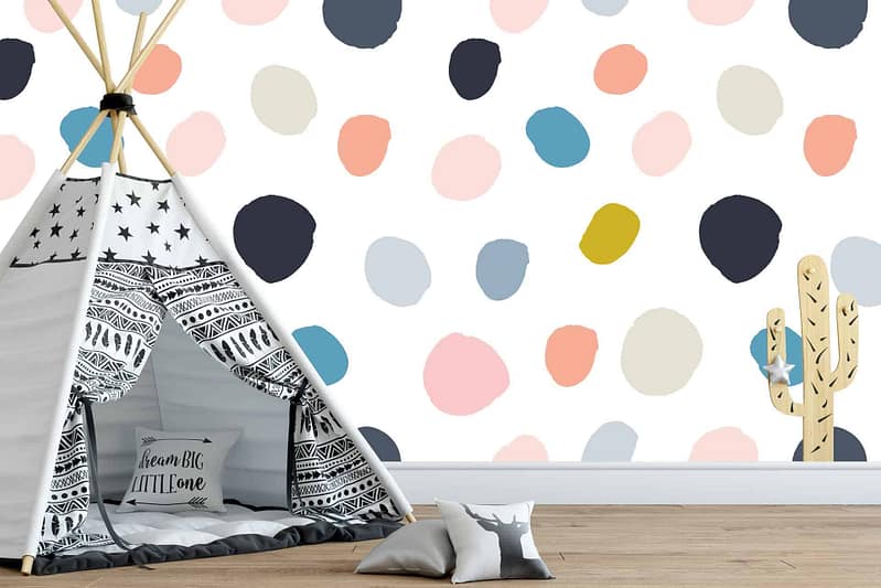 The wallpaper features whimsical, multicolored dot patterns. Elements include dots in a variety of colors including red, blue, yellow, and green.