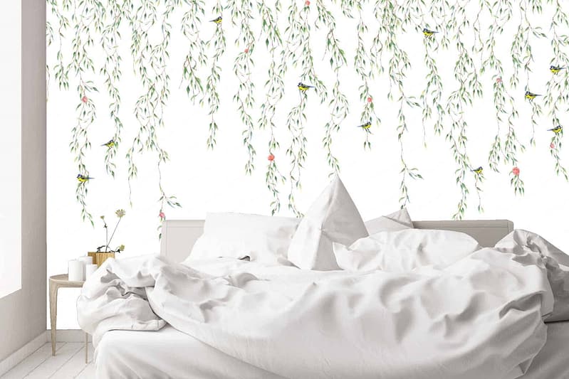 The wallpaper features a mural of hanging green leaves and small birds against a white background.