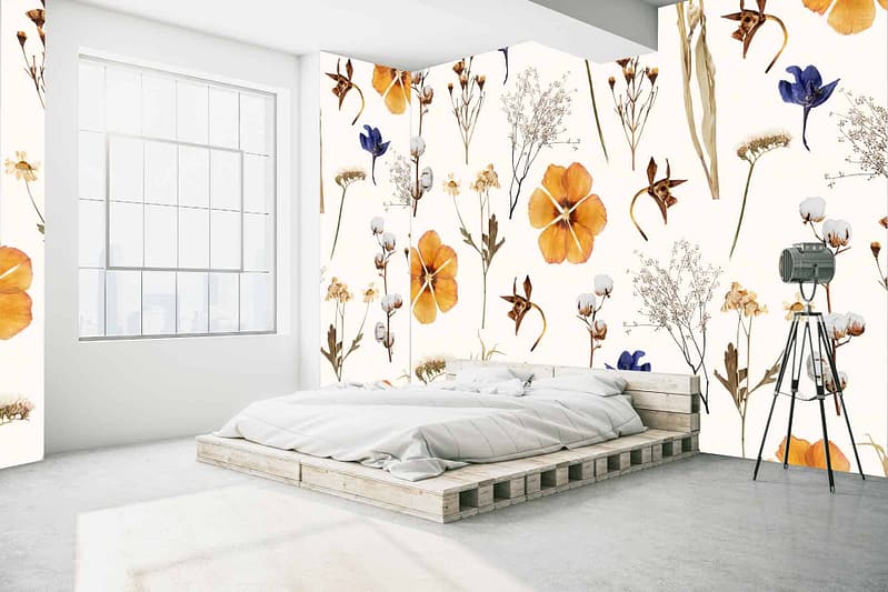 The wallpaper features vibrant floral patterns showcasing orange, yellow, blue, and brown flowers on a minimalist backdrop. These colors—orange, yellow, blue, and brown—intertwine to create a lively yet elegant motif. The floral design adds a burst of color and visual interest to the room's decor.