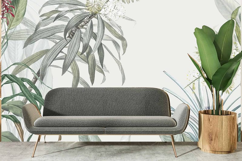 The wallpaper features a large botanical mural showcasing detailed illustrations of lush, green leaves and delicate floral patterns. The primary elements include various shades of green foliage interspersed with subtle highlights of white and light brown stems. The design captures the essence of nature, making it ideal for eco-friendly environments like Earth Day celebrations.