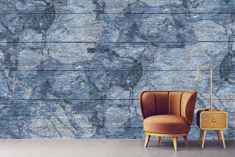 The wallpaper features a striking deep blue and gray textured design with a stone-like appearance, adding elegance to the room.
