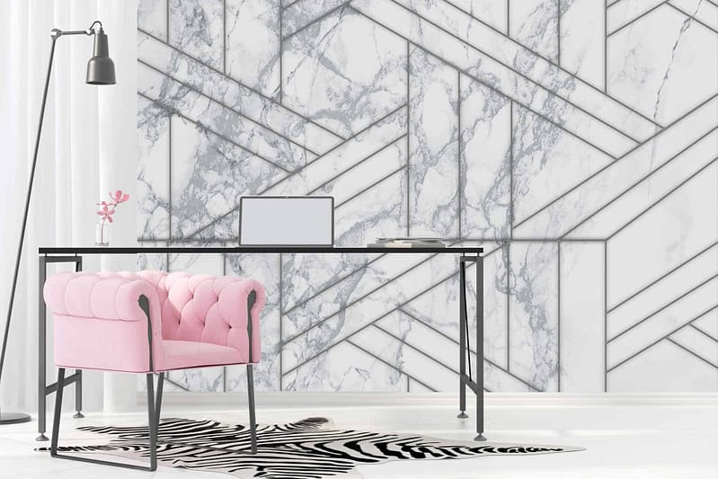The wallpaper features abstract geometric patterns and shapes reminiscent of New York landmarks. It includes a mix of marble textures with white, gray, and black hues to create a sophisticated backdrop.