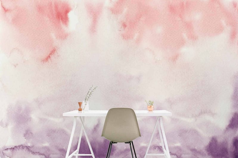 Gradient watercolor wall in hues of pink and lavender.