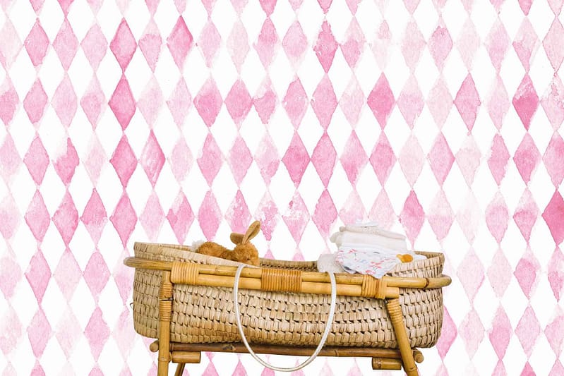 White and pink diamond-patterned wallpaper with a whimsical Fantasia vibe.