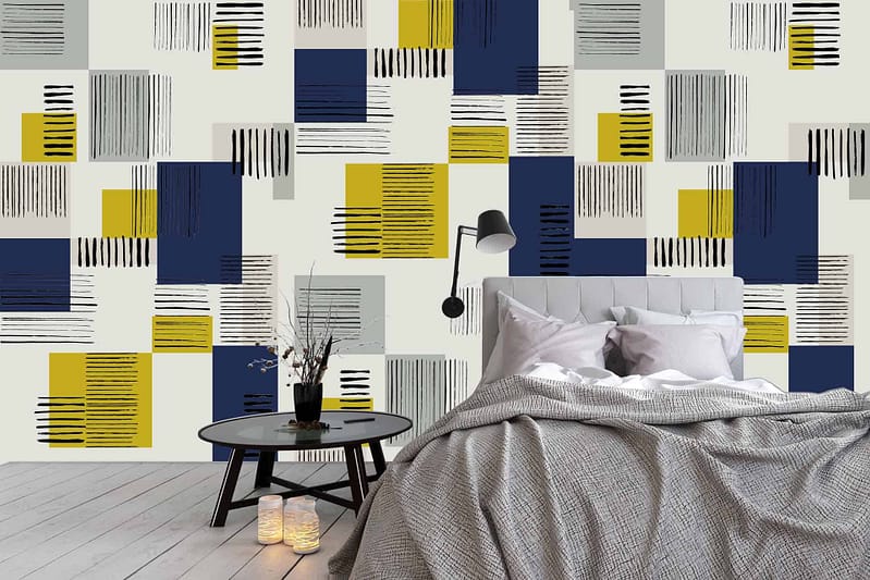Geometric accent wall with navy, yellow, and light gray rectangles and lines.