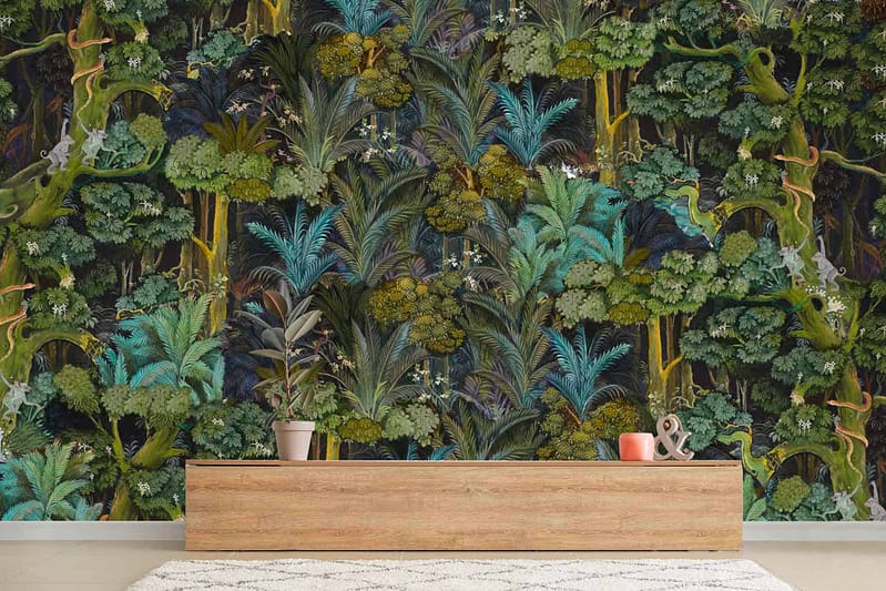 The wallpaper features dense foliage in various shades of green and blue, reminiscent of the Gardens of Babylon. It includes lush tropical leaves, intricate vines, and exotic plants, creating a vibrant jungle theme.