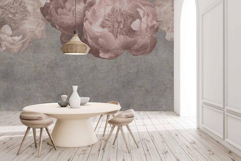 The wallpaper features large, soft pink flower murals on a gray background. The overall aesthetic is delicate and elegant, incorporating shades of pastel pink that softly blend into the sophisticated gray backdrop.