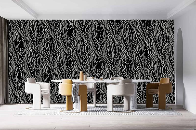 The wallpaper features a striking black and white abstract pattern with bold, geometric shapes interwoven in dynamic forms. The contrast of sharp lines and flowing curves creates a visually stimulating backdrop perfect for modern minimalist spaces. Colors: Black, White. Elements: Geometric shapes, Abstract pattern, Bold contrast, Sharp lines, Flowing curves.