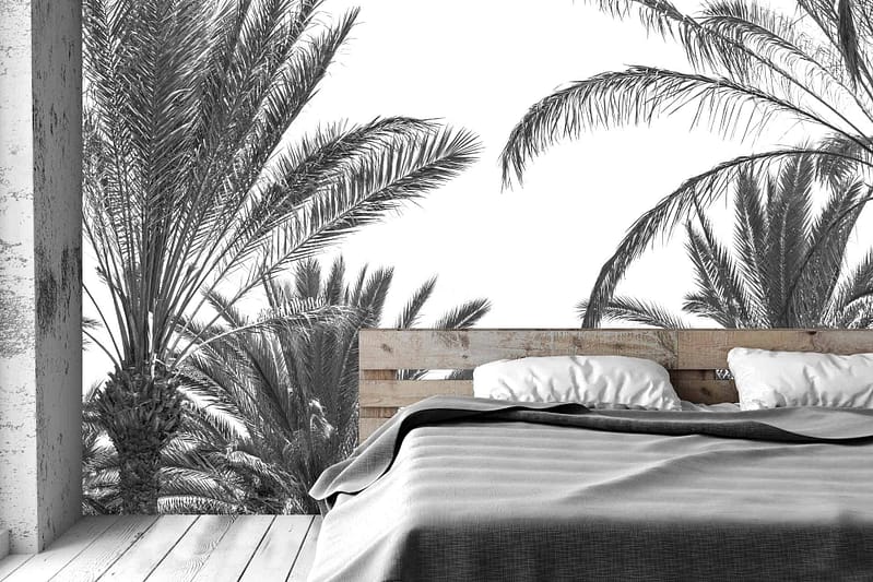 Mural wallpaper features tall, detailed palm trees in black and white, creating a serene, island-hopping ambiance.