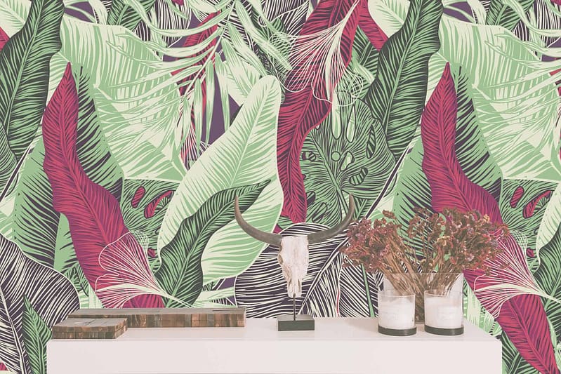 The wallpaper features a vibrant tropical leaf pattern in green, purple, and red hues. The design showcases lush foliage with a rich color palette, creating an island-inspired atmosphere.