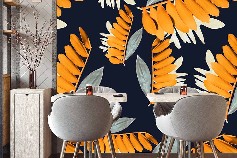 The wallpaper features Joany's vibrant orange and muted green leaf patterns set against a bold, dark background.