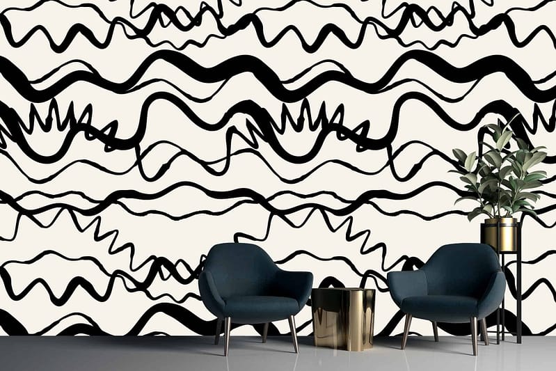 White wall adorned with bold, abstract black wavy lines and squiggles, reflecting unpredictable twists and turns.