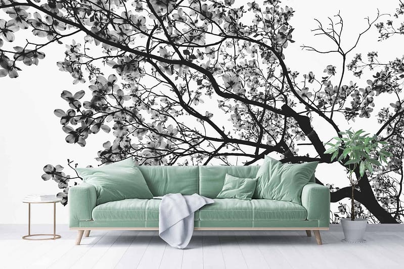 A black-and-white mural of tree branches and blossoms. Elements include tree branches and blossoms with intricate details in monochrome shades. Colors: black and white.