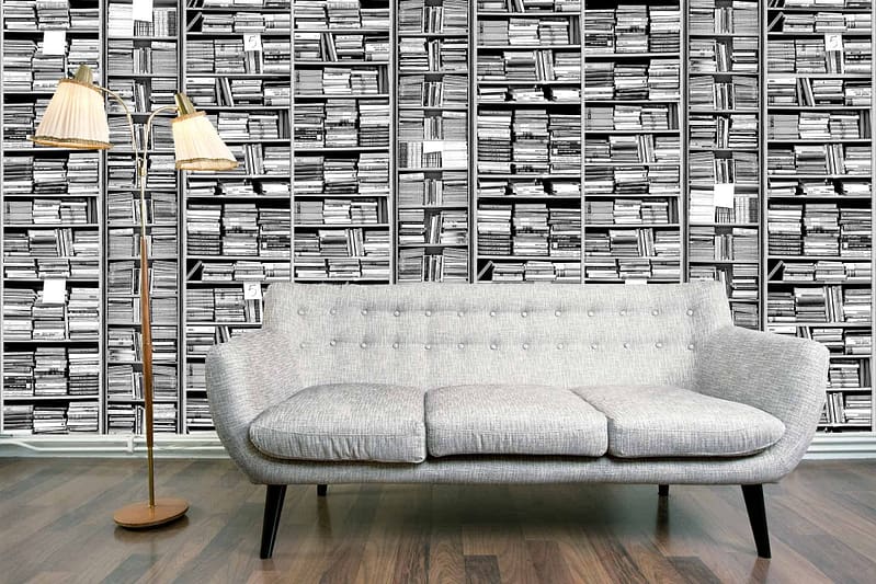 The wallpaper simulates a bookshelf filled with numerous black-and-white books, reminiscent of lost pages.