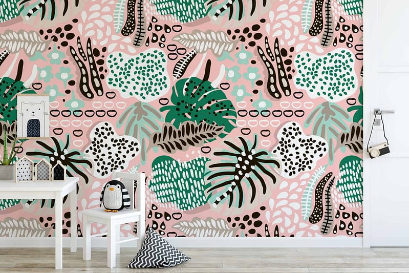 Children's room with tropical-themed wallpaper featuring playful shapes and patterns in green, pink, black, and white.