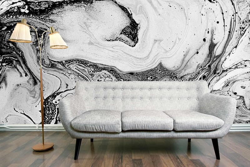 The wallpaper features a striking black and white marbled design.