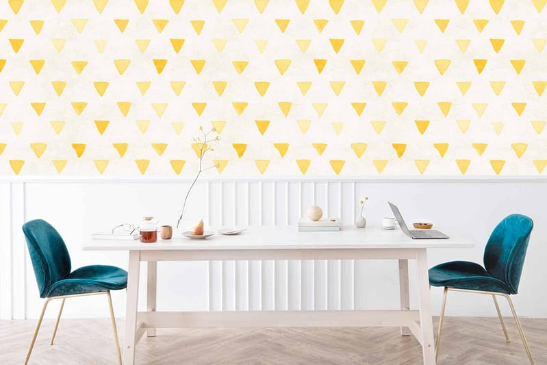 Mellow yellow triangular patterns on the wall.