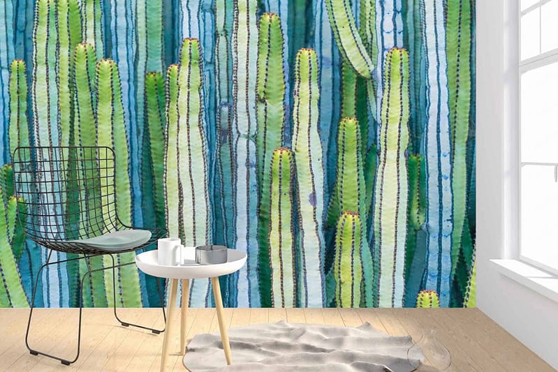 A large mural featuring tall, green cacti reminiscent of the Namib Desert decorates the wall. The wallpaper showcases various shades of green against a desert backdrop.