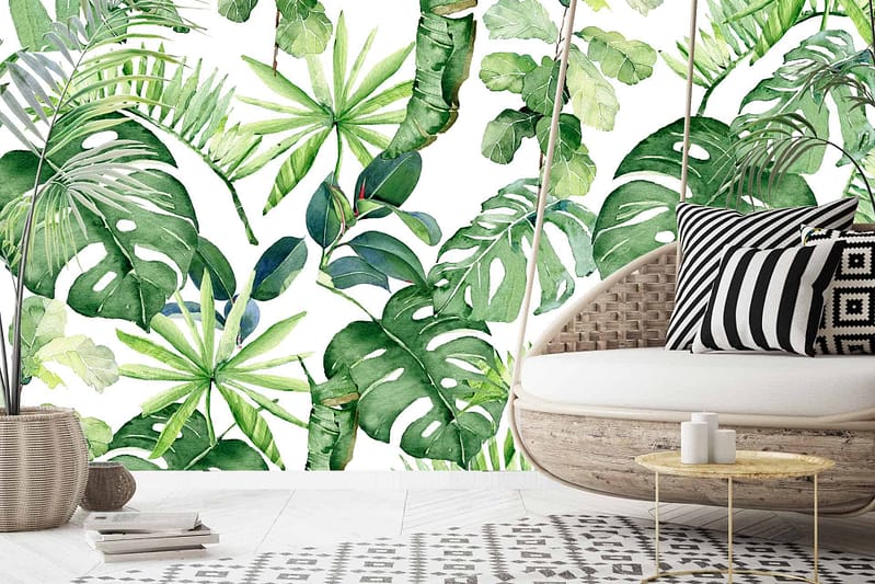 The vibrant wallpaper features various green tropical leaves, creating a lush and inviting backdrop. Key elements include banana leaves, palm fronds, and monstera leaves in shades of emerald, lime, and forest green. Touches of deeper greens and subtle yellow accents add depth and dimension to the design.