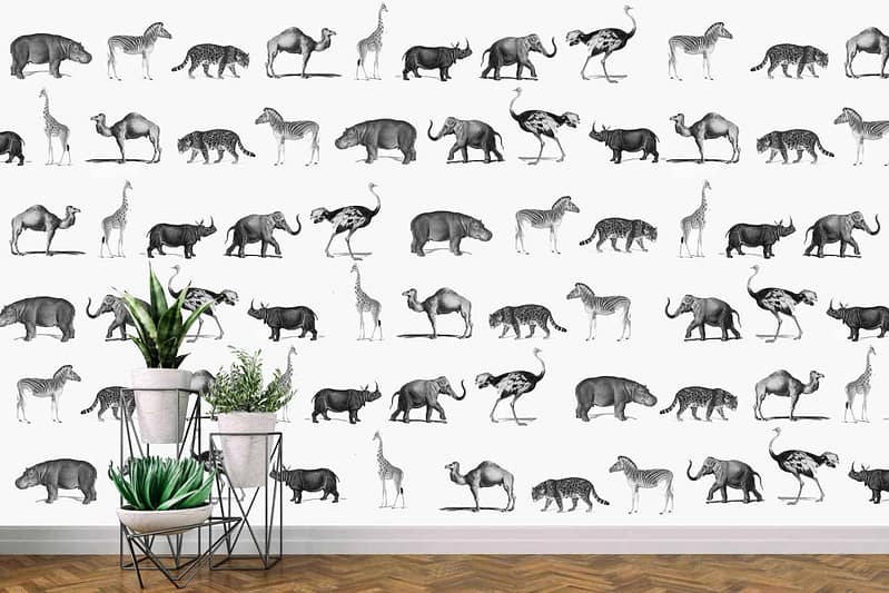White wall panel, repeating pattern, black and white animal illustrations, Noah's Ark theme, giraffes, leopards, ostriches, camels, zebras.
