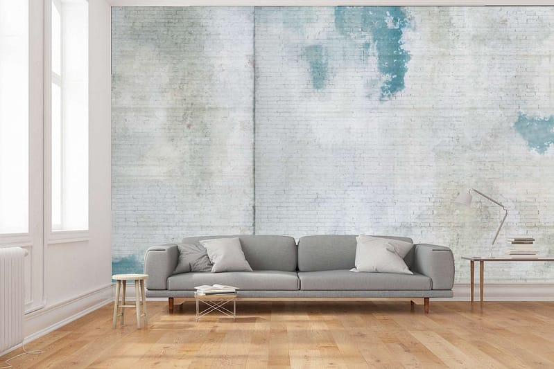 The wallpaper is a distressed design featuring blue and white painted bricks. Elements include the uneven texture of brick and varying shades of blue mixed with white.