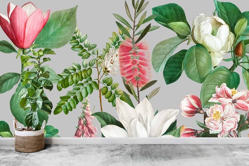 A wall mural featuring vibrant, large illustrated flowers and leaves in shades of green, pink, red, and white captures the essence of "Pretty in Pink".