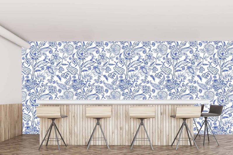 The wallpaper in the modern minimalist cafe in Robertson features intricate blue and white floral patterns.