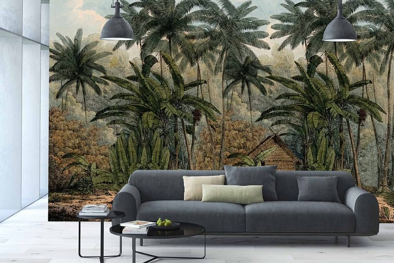 The wallpaper is a striking mural featuring a lush tropical scene inspired by Robinson Crusoe’s adventure. It includes rich green foliage, vibrant flowers, and exotic plants, set against a backdrop of deep blues and earthy browns.