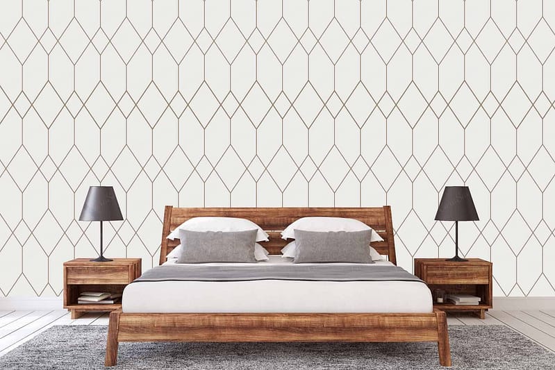 The wallpaper in the modern bedroom features a bold geometric pattern. The design includes sharp lines and shapes that create an intricate, contemporary look. Predominantly composed of black, white, and various shades of gray, these colors are interwoven to form striking contrasts and visual depth. This monochromatic palette enhances the room's overall aesthetic by adding a sophisticated yet dynamic backdrop.