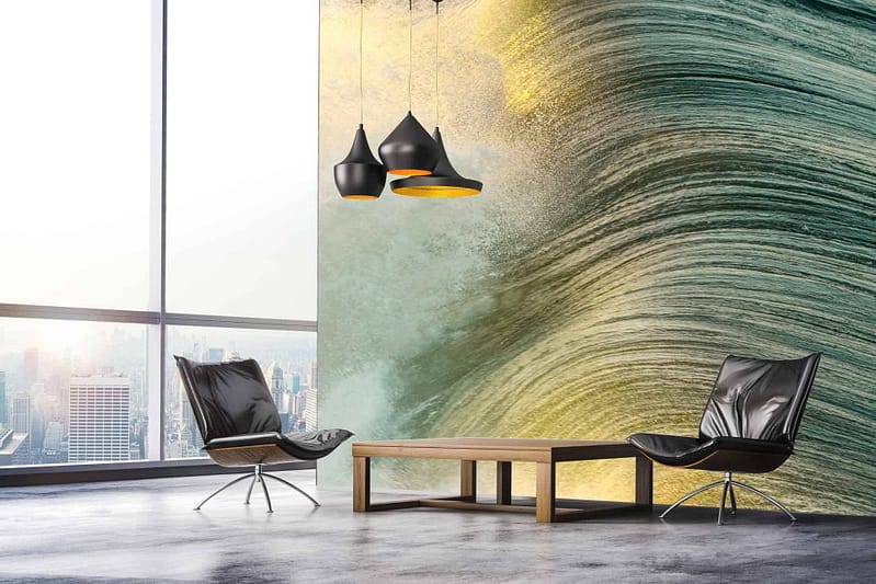 The wallpaper is a wall mural featuring a green and yellow textured wave.