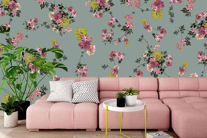 The wallpaper features a floral pattern with vibrant colors such as soft pinks, lush greens, and subtle cream accents. The design includes detailed flowers and leafy motifs that enhance the cozy Sherry-inspired vibe of the room.