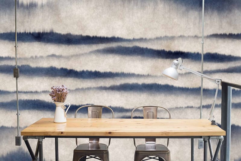 The wallpaper is a calming watercolor pattern featuring shades of blue and gray. It has a dreamy, shifting appearance that evokes a sense of tranquility and subtle movement.