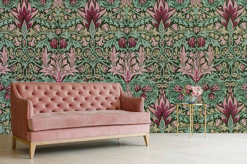 Intricate floral wallpaper in shades of green and pink features prominently. The pattern includes detailed, elegant flowers, evoking a delicate and charming atmosphere.
