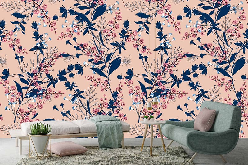 A modern living room features a large, floral-patterned wall with navy and pink flowers on a light peach background.