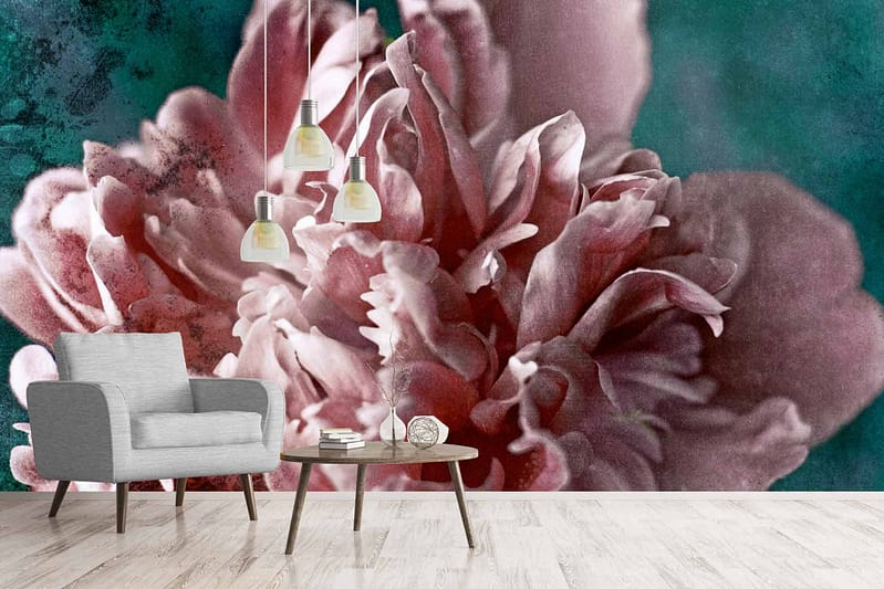 The wallpaper features an enlarged, detailed close-up of a pink flower with a textured green and blue background. Elements include intricate floral petals in shades of pink and soft pastels, contrasted against vibrant greens and subtle blues. Perfect for adding a touch of nature-inspired elegance to any space.
