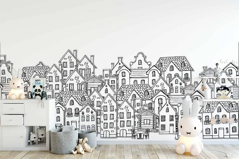 The children's room features a white wall decorated with black-and-white cartoon drawings of houses. The wallpaper is minimalist, using only black and white elements to create whimsical house designs.