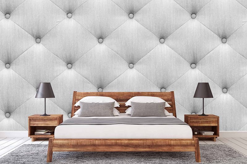 Textured, diamond-patterned wallpaper in various shades of gray exudes a modern and sophisticated aesthetic.