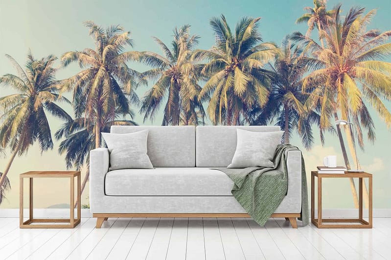Tall sunlit palm trees mural, clear sky backdrop, bright and airy Riviera vibe.