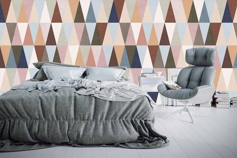 A vibrant geometric accent wall adorned with multicolored triangles, reminiscent of *This is Us*.