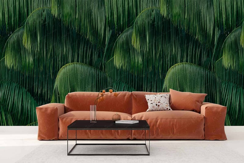 The wallpaper features elegant weeping green palm leaves on a subtle, textured background. The palette includes varying shades of green against a neutral base, emphasizing the lush, intricate details of the foliage.