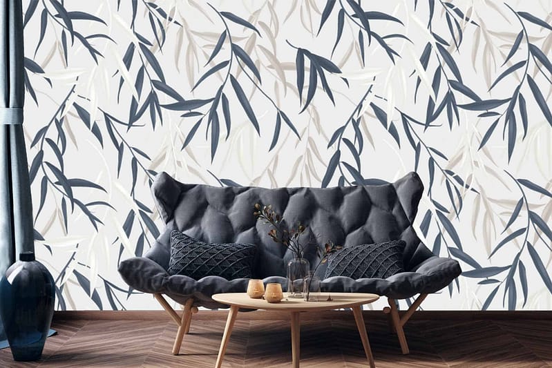 Abstract leaf-patterned wallpaper in shades of gray and beige.