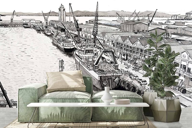 A modern living room featuring a black and white mural of Cape Town's bustling harbour. The wallpaper showcases intricate details of cranes, ships, and the busy port scene. The monochrome tones create a striking contrast, emphasizing the dynamic activity of the harbour. Black and white elements dominate this captivating wallpaper design.