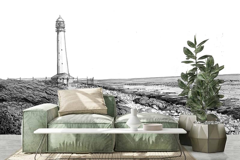 The wallpaper features a monochrome illustration of the Kommetjie Lighthouse by the shore, with shades of black, white, and gray. The serene coastal theme highlights detailed linework depicting waves, rocks, and the lighthouse structure.
