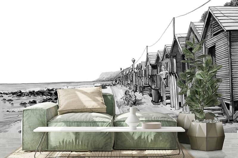 The wallpaper features a detailed black-and-white mural of seaside cabanas lined up beside a rocky shore, adding depth and character to the space. It is reminiscent of St James' tranquil coastlines.