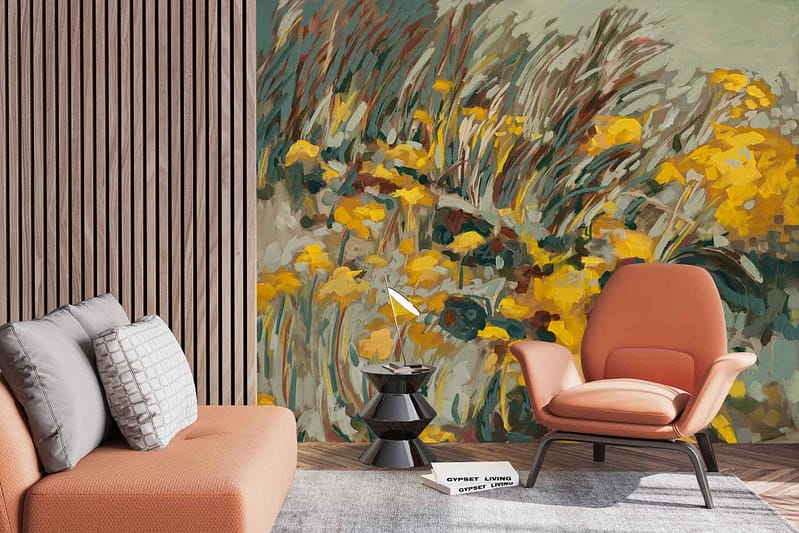 The wallpaper in this modern living room features a vibrant mural adorned with yellow flowers and lush greenery. The floral design includes shades of green leaves and stems, creating a lively and dynamic backdrop. The bright yellow flowers add a pop of color against the natural tones, making the mural stand out as a focal point in the space.