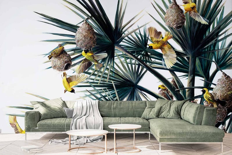 Nature-themed wall mural with yellow birds in flight and perched on nests among large green tropical leaves. Lush foliage is depicted in vibrant shades of green, creating a tropical ambiance. The scene captures the harmonious beauty of nature, evoking the feeling of "Sky Sings." Yellow birds and nests provide contrasting focal points amidst the greenery.